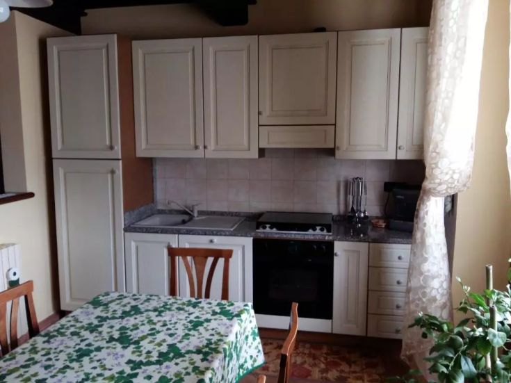 Bright kitchen with light furniture. A great space for family meals.