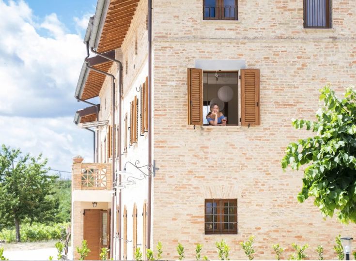 A serene environment with a panoramic view of vineyards set in a historical context.