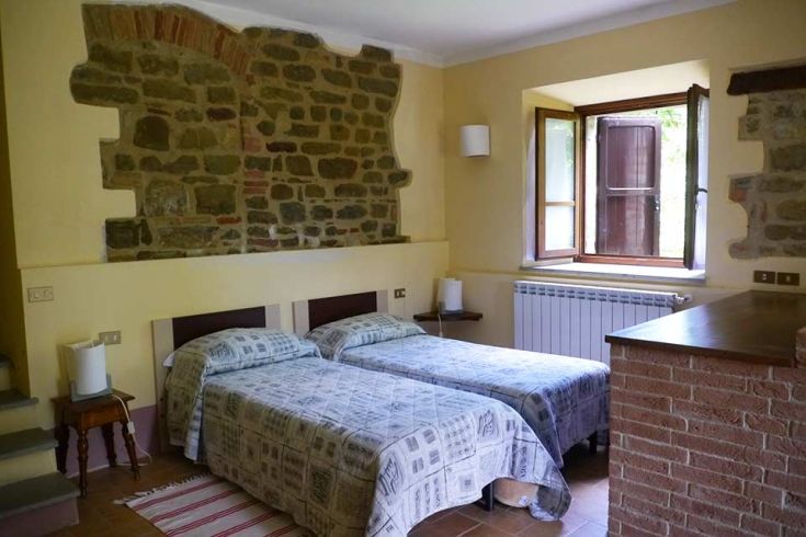 Bright room with stone walls and a view of surrounding nature. A perfect environment for relaxation.