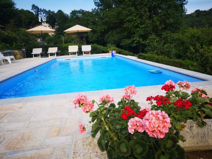 Discover the relaxation of B&B Villa Ginevra, surrounded by trees and featuring an outdoor pool.