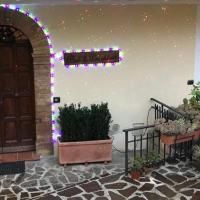 Entrance of a cozy B&B with decorative lighting and potted plants.