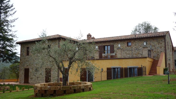 A renovated farmhouse surrounded by greenery, with vineyards and olive trees. Perfect for a peaceful stay.