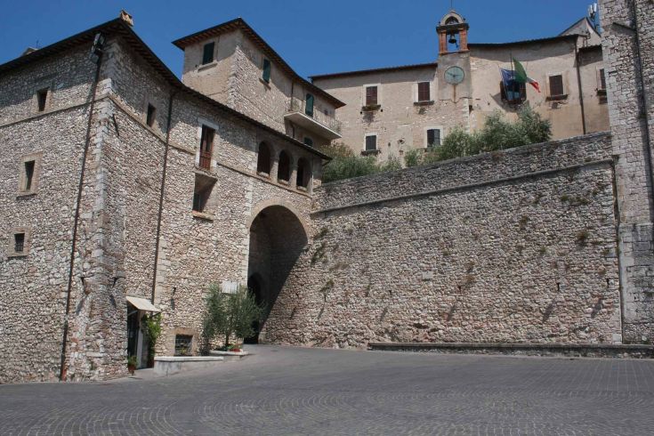 A view of the medieval village of Stroncone, featuring historic stone buildings and peaceful streets.