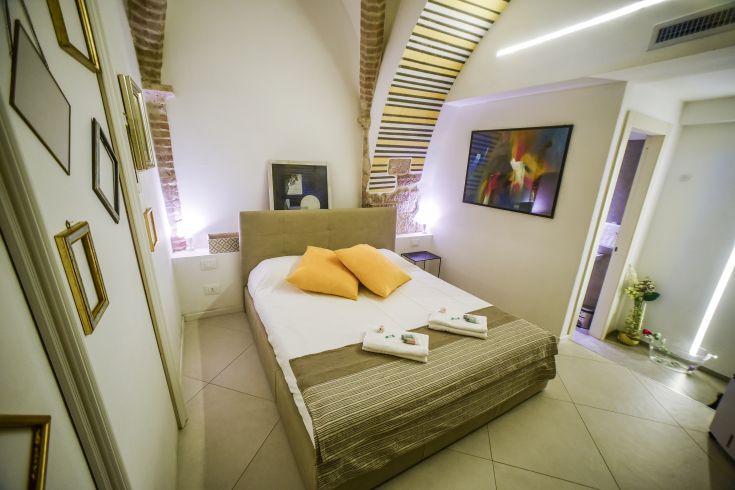 Double room in an 11th-century former church, featuring original architectural details.