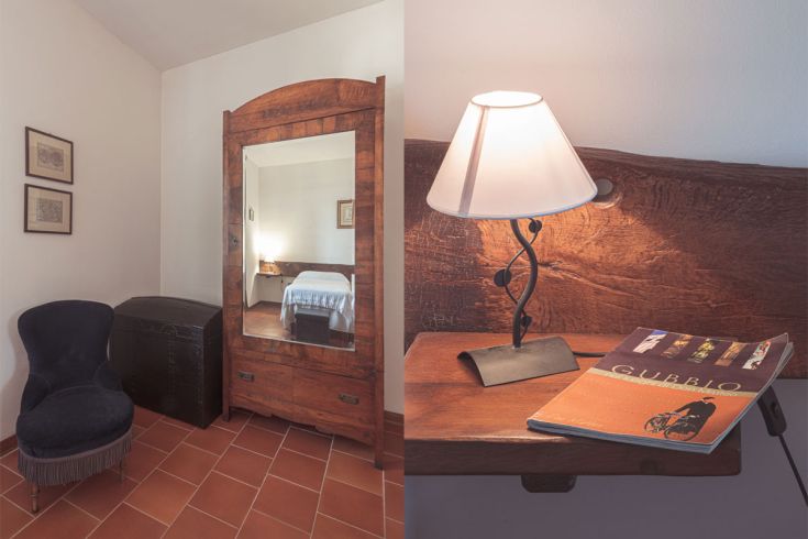 Interno semplice di un agriturismo, con mobili in legno e una lampada discreta.