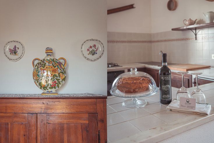 Cucina con elementi semplici: un vasetto decorato e una selezione di dolci e vino rosso sulla tavola.