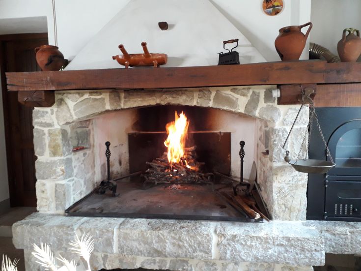 A simple and warm path with burning wood in a typical agriturismo of the Umbria region.