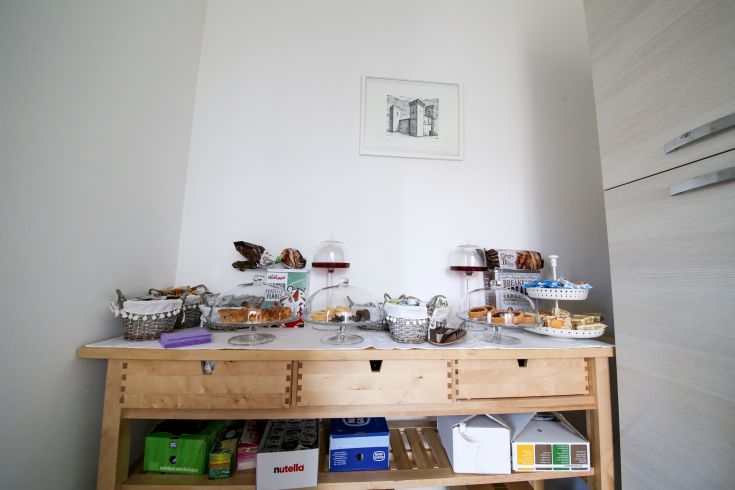 A table set with sweets and drinks in a bright and welcoming environment.