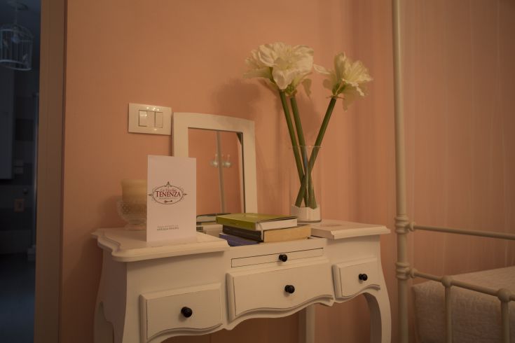 Interior of a building with shabby chic details and understated floral decorations.