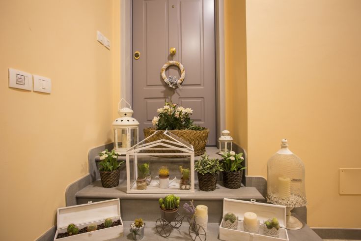 Cozy entrance of a building turned into a B&B, featuring simple and inviting details.