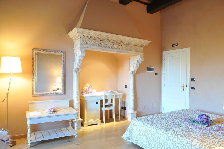 Interior of a palace featuring historic furniture and modern comforts, perfect for a relaxing stay.