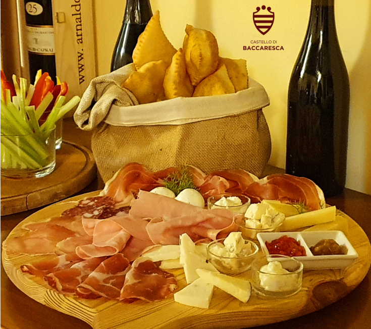 A Umbrian appetizer featuring cold cuts, assorted cheeses, and focaccia. Perfect for social gatherings.