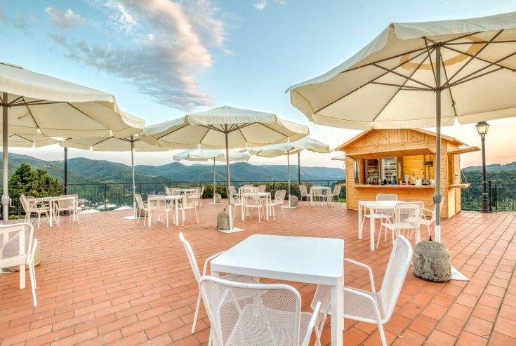 An outdoor terrace surrounded by natural elements, perfect for events and ceremonies.