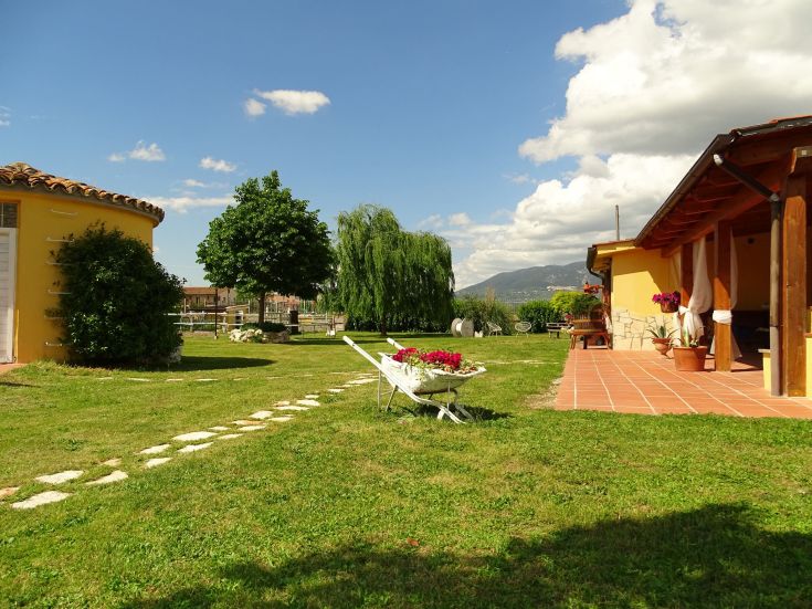 Outdoor space with a serene view of a green landscape.