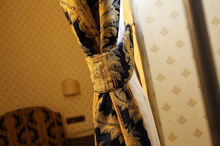 Detail of a decorative curtain with a simple and elegant design.