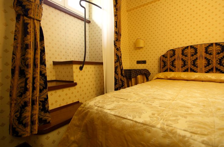 Comfortable room with simple furnishings and a double bed.