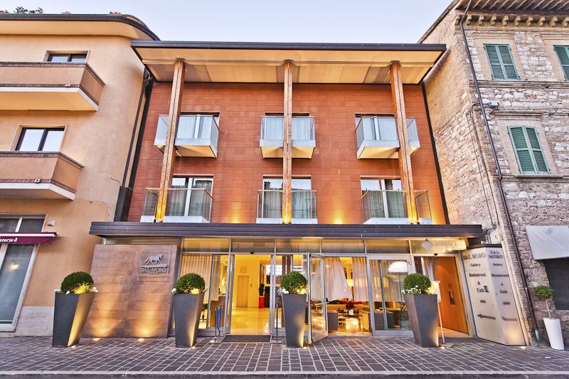 The facade of the Palazzo Dal Moro Gallery Hotel, a stylish hotel in Umbria, featuring simple lines and architectural details.