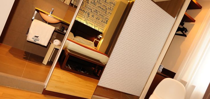 Modern room at Dal Moro Gallery Hotel in Assisi with unique furnishings and comfort.