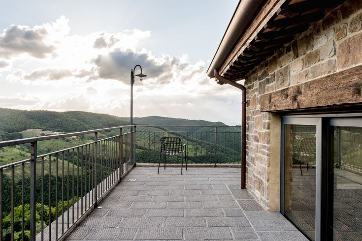 A terrace overlooking the hills, perfect for relaxation while the sun sets.
