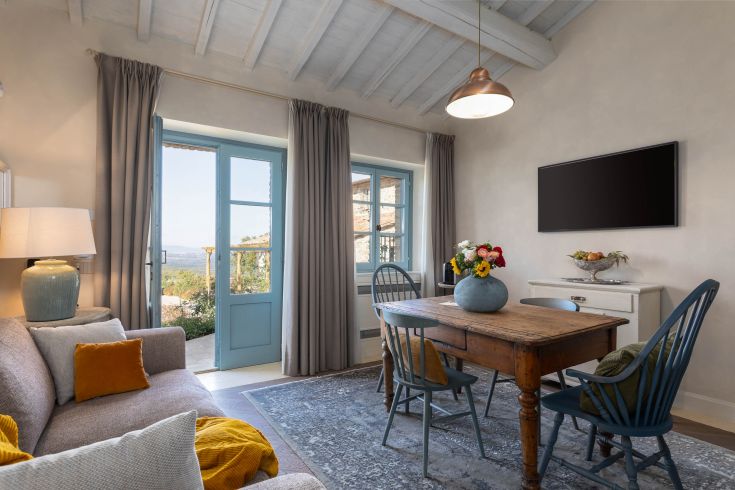 A bright and cozy living room, simply and functionally furnished, conveying a calming atmosphere.