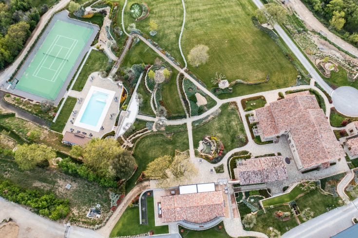 A charming property in the Umbrian countryside, featuring a swimming pool, well-maintained gardens, and a tennis court.