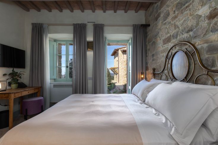 Cozy room with a panoramic view of the hills, perfect for a holiday in Umbria.