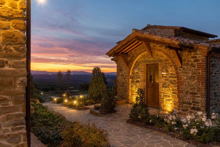 A picturesque corner in Umbria, featuring simple architecture and a serene landscape.