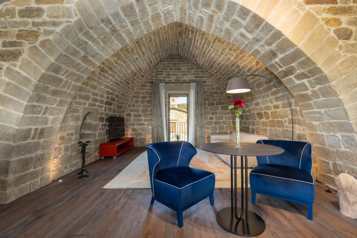 A corner featuring stone structures and minimalist furnishings in a well-maintained environment.