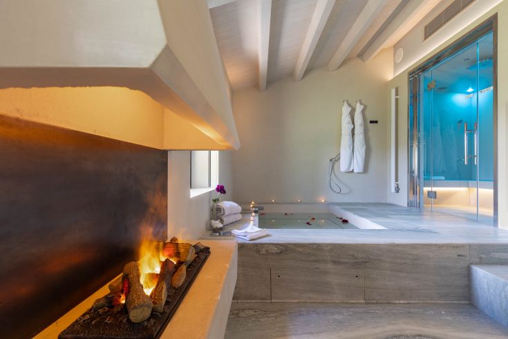 A serene atmosphere with a private spa and a stunning view of the Umbrian countryside.