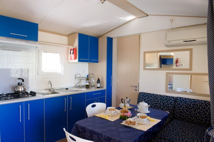 Simple kitchen with blue details, perfect for cooking meals together.