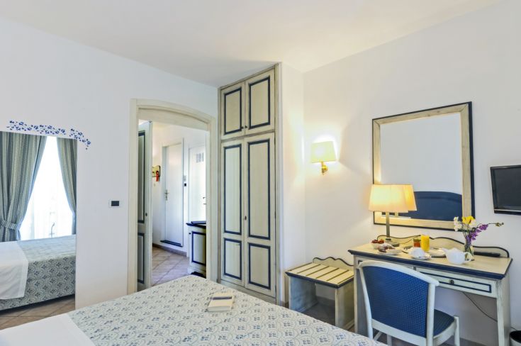 Cozy room with a view of Lake Trasimeno, equipped with modern comforts.