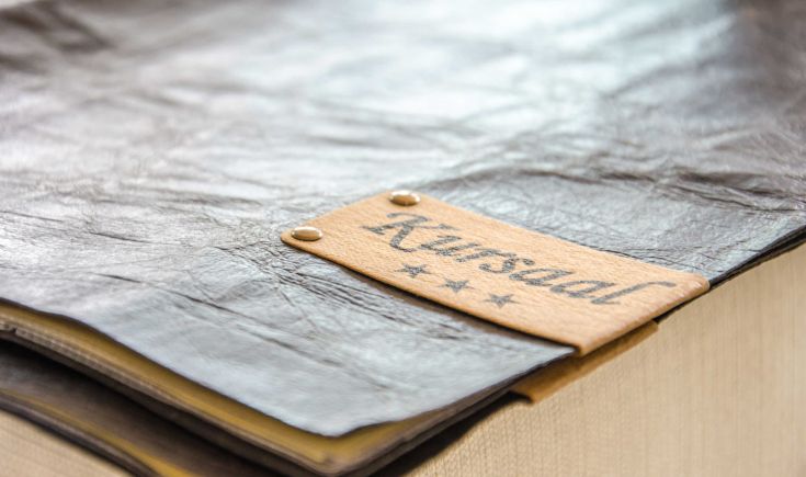 A peaceful campsite by Lake Trasimeno, featuring pitches surrounded by trees and green areas.