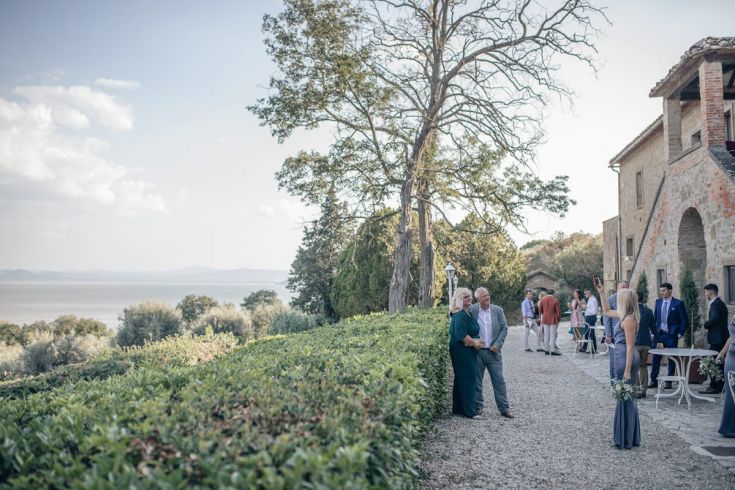 An informal outdoor event in a picturesque area overlooking the lake with neat squares.