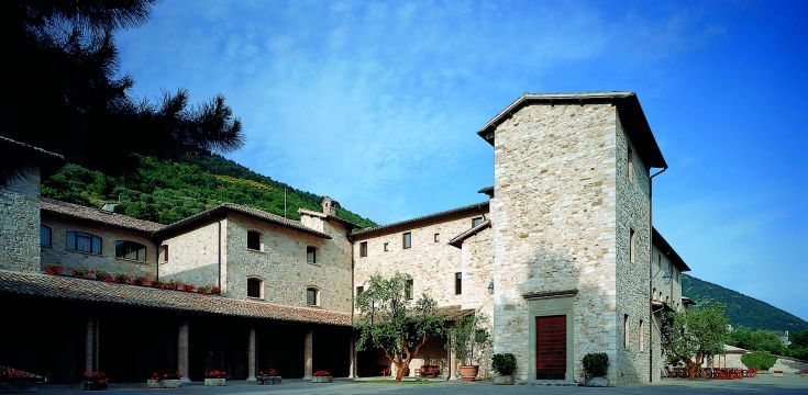 Renovated monastery in Gubbio, blending historical and modern elements in a captivating setting.