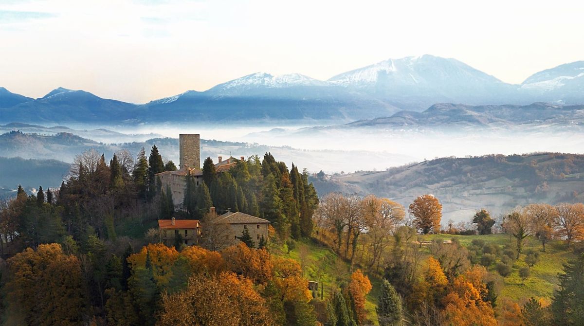 Petroia Castle, a historic building with simple rooms and a cozy atmosphere.