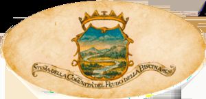 Wappen des Biscina-Anwesens, umgeben von grünen Hügeln, symbolisiert einen ruhigen Ort in Umbrien.