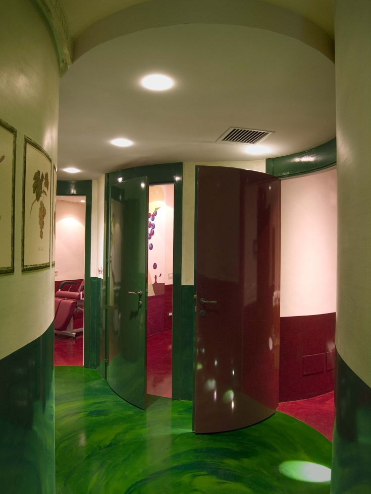 A bright hallway with modern doors, decorated in warm colors that create a cozy atmosphere.