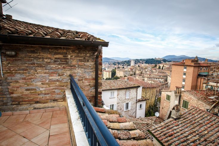 A panoramic view of historical rooftops, showcasing buildings that reflect the atmosphere of a bygone era.