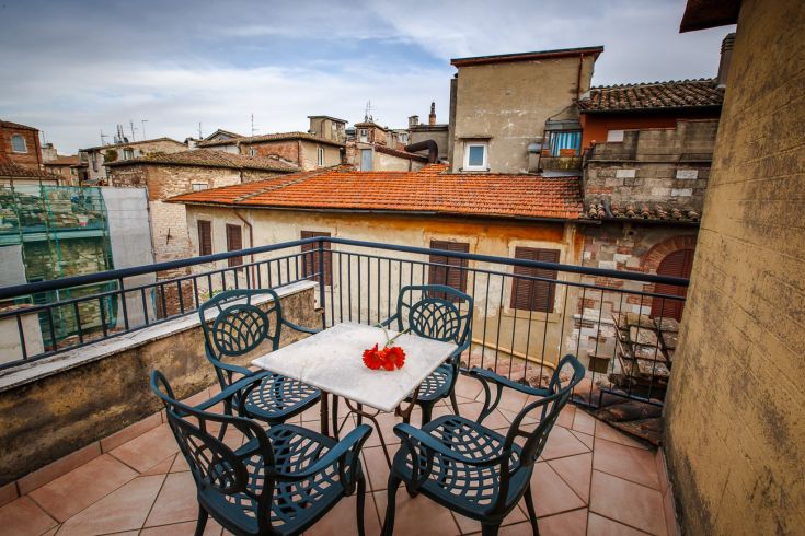A panoramic terrace overlooking the surrounding rooftops, perfect for outdoor relaxation.