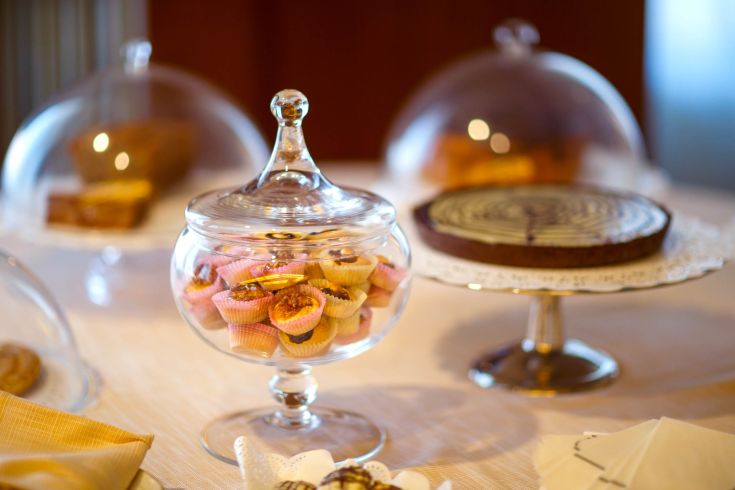 Trays filled with pastries and sweets arranged in a simple and inviting setting.