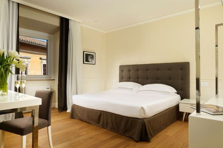 Hotel room with simple furnishings and a cozy atmosphere, perfect for couples.