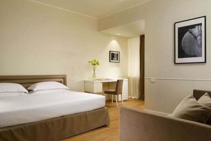 Cozy, well-furnished room at Hotel della Posta, a boutique hotel in a quiet area of Perugia.