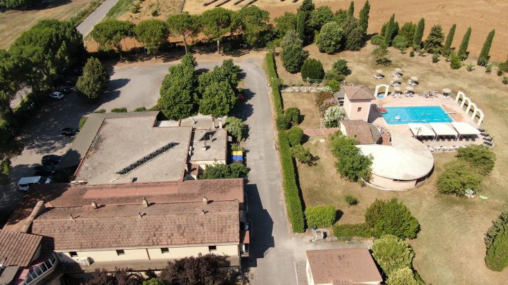 A serene hotel nestled in a park with a swimming pool, located in a quiet area between Assisi and Gubbio.