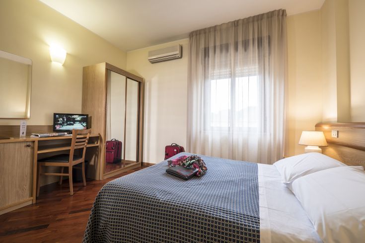 Spacious and cozy hotel room, perfect for a relaxing and comfortable stay.