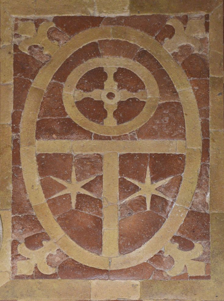 A mural featuring geometric shapes and stars in shades of red and beige.