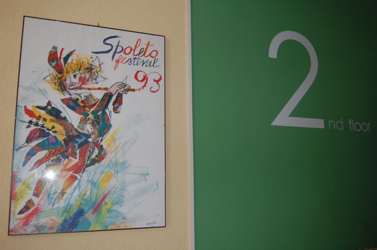 Poster of the 1993 Spoleto Festival next to the signage on the second floor.