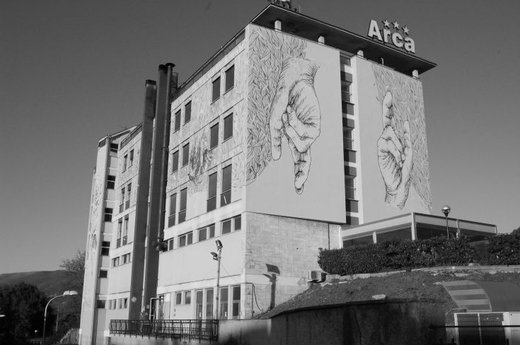 Facade of a building with modern wall decorations, creating a youthful and welcoming atmosphere.