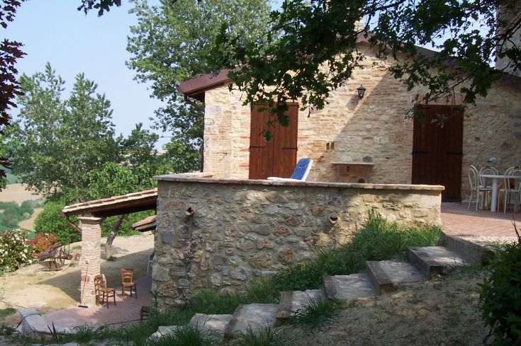 Organic farmhouse set in nature, close to Todi, featuring a serene view.