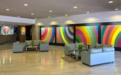 Welcoming space inside Palazzo Albornoz, featuring simple furnishings and cozy corners for relaxation.