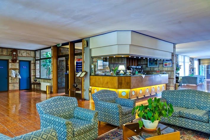 A cozy area in the hall of the Garden Hotel, perfect for a short break.